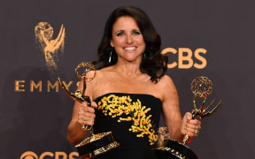Julia Louis-Dreyfus as she poses with the Emmy for Outstanding Lead Actress in a Comedy Series for "Veep" during