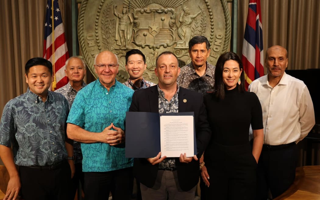 Hawaii Governor Josh Green poses after signing Housing Emergency Proclamation, July 19, 2023