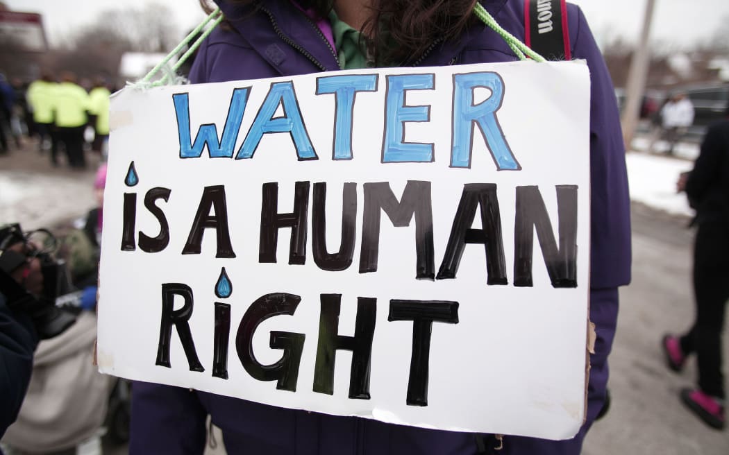 A protester calling for clean water in Flint, Michigan.