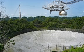 View of the Arecibo radio telescope primary dish and the spherical reflector