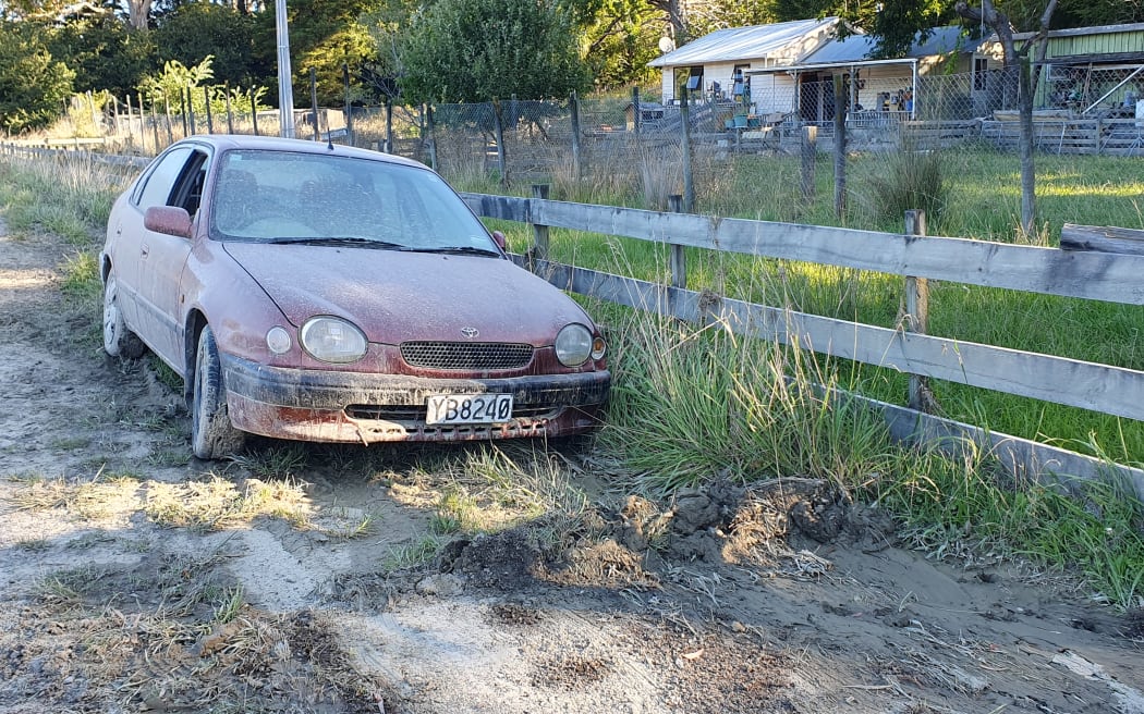 An abandoned mud covered car outside Tinui shows how high the Whareama River got, near Wairarapa's east coast.