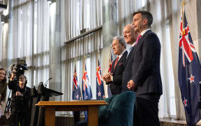 Coalition agreement signing ceremony between Christopher Luxon, David Seymour and Winston Peters.