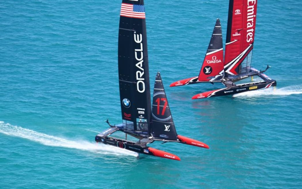Team New Zealand and Oracle during racing on the second day of the America's Cup final racing.
