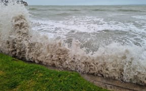 Large swells have been hitting coastal regions, including at high tide in Browns Bay, Auckland.