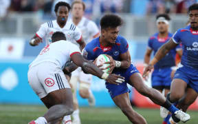 Samoa's Joe Perez challenges the USA defence during the Cup final in Las Vegas.