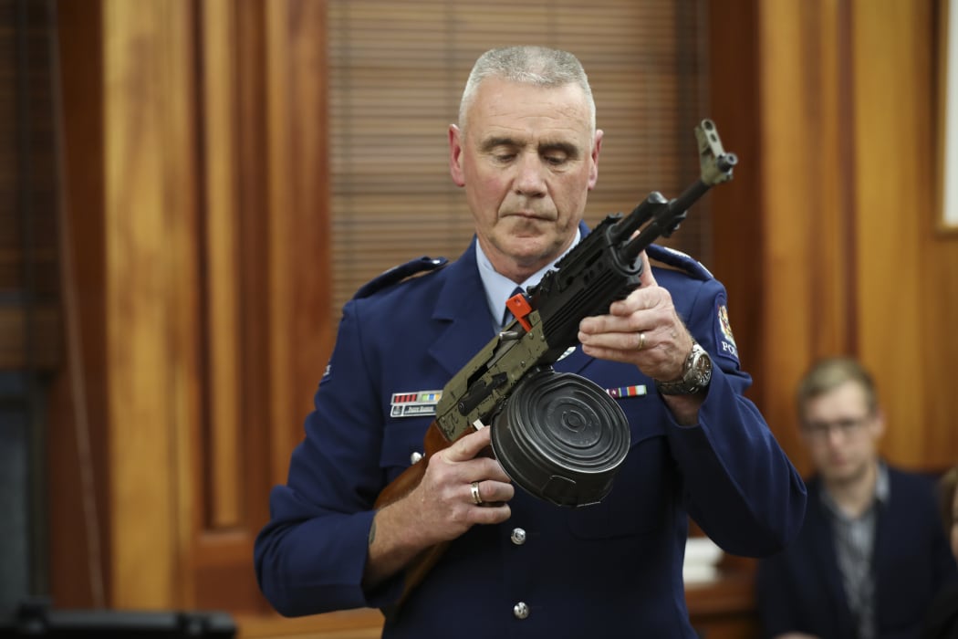 Police officer Paddy Hannon demostrates illegal gun modifications