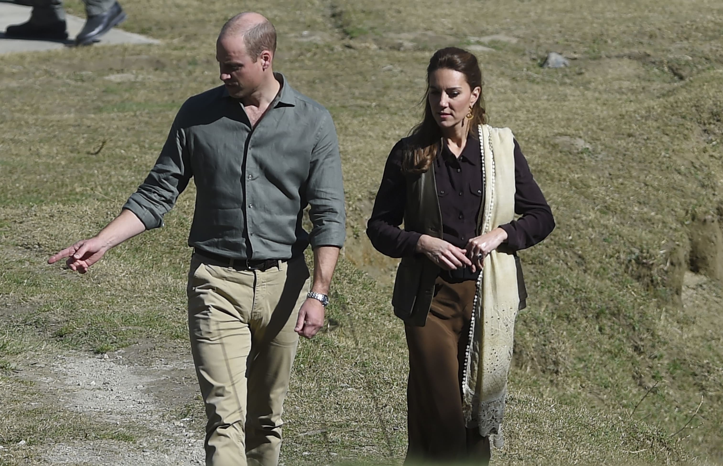 Britain's Prince William (L), Duke of Cambridge and his wife Catherine (R), Duchess of Cambridge, walks on their arrival at the Kalash tribe village in Bumburate Valley in Pakistan northern Chitral District on October 16, 2019.