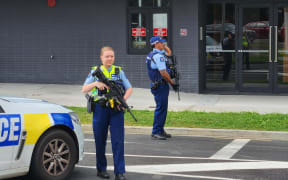 Armed police in Henderson, West Auckland, after police shot and wounded a man following an attempted robbery, 17 March 2023.