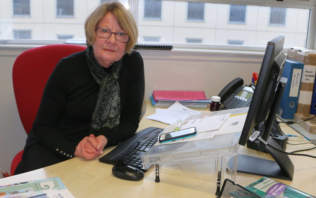 Hilary Graham-Smith of the Nurses Organisation, sitting at her desk