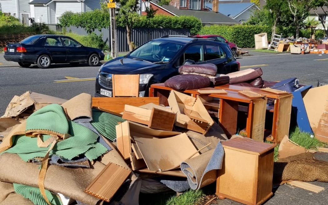 Auckland flooding - piles of rubbish on Shackleton Road in Mt Eden