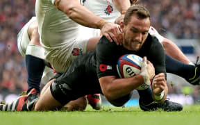 Aaron Cruden goes over for a try against England.