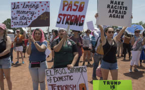 El Paso residents protest against the visit of US President Donald Trump to the city after a shooting that left a total of 22 people dead.