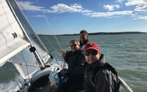 Ed Carrell and two friends sailing on the Solent