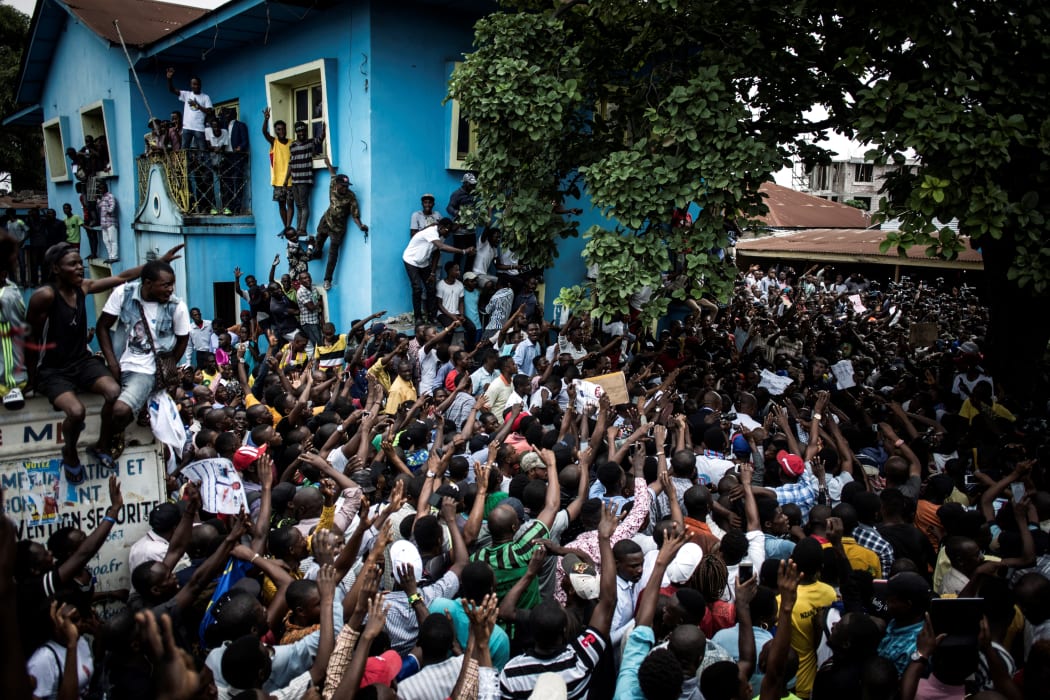 Supporters of Democratic Republic of Congo opposition leader Martin Fayulu take part in a protest to contest presidential election results on 11 January, 2019, in Kinshasa.