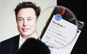 ISTANBUL, TURKIYE - JULY 9: In this photo illustration Tesla and SpaceX CEO Elon Musk's twitter profile is displayed on a mobile phone screen and the image of Elon Musk is displayed on a computer screen in Istanbul, Turkiye on July 9, 2022. Tesla CEO Elon Musk announced Friday that he is pulling out of his $44 billion deal to buy Twitter. Celal Gunes / Anadolu Agency (Photo by Celal Gunes / ANADOLU AGENCY / Anadolu Agency via AFP)