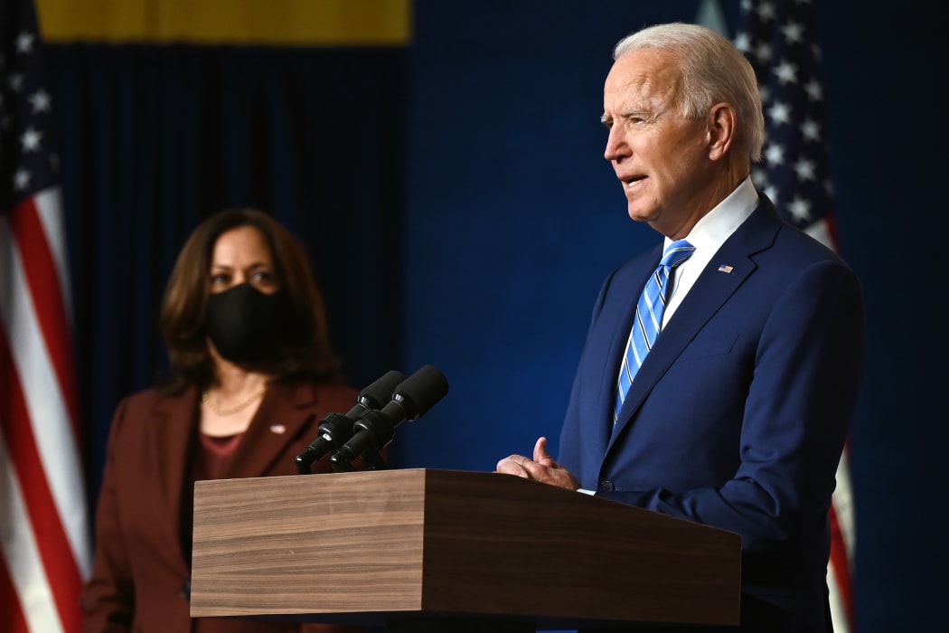 Democratic Presidential candidate Joe Biden, flanked by US Democratic vice presidential nominee and Senator from California, Kamala Harris, speaks in Wilmington, Delaware, on 4 November.