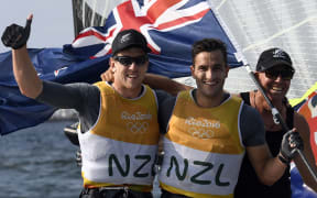 New Zealand sailors Peter Burling and Blair Tuke celebrate winning gold at the Rio Olympics.