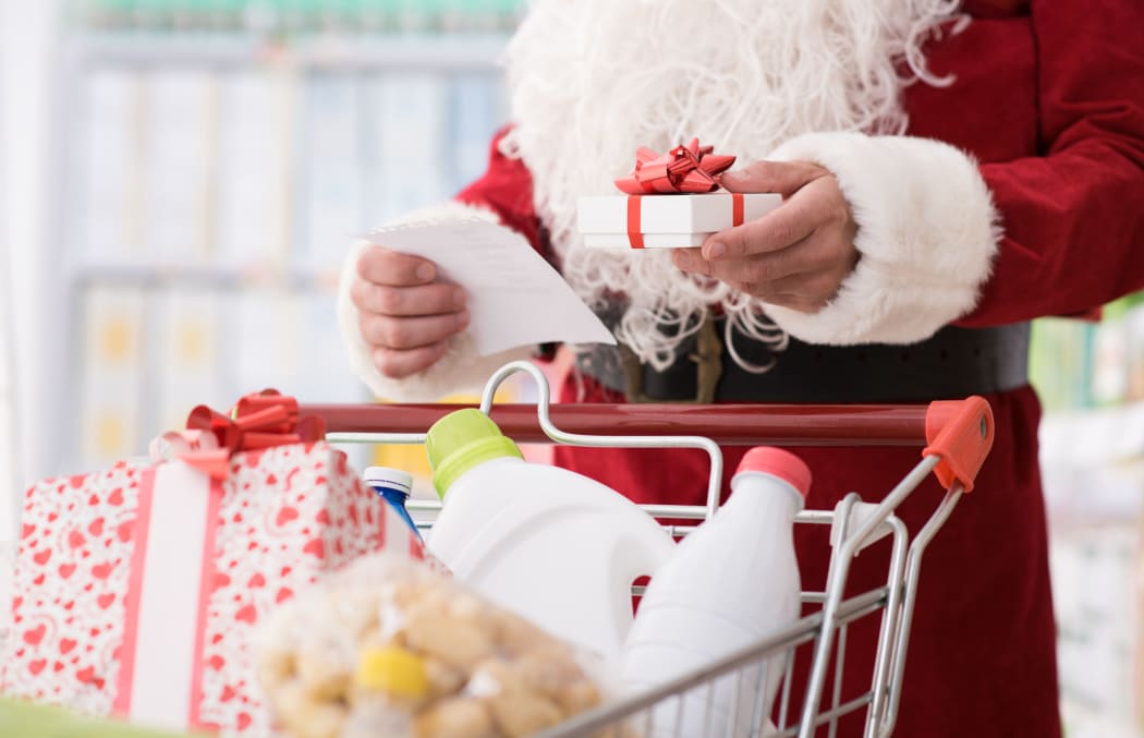 Santa Claus doing grocery shopping at the supermarket,