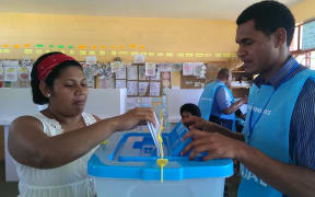 A woman votes in the Fiji elections.
