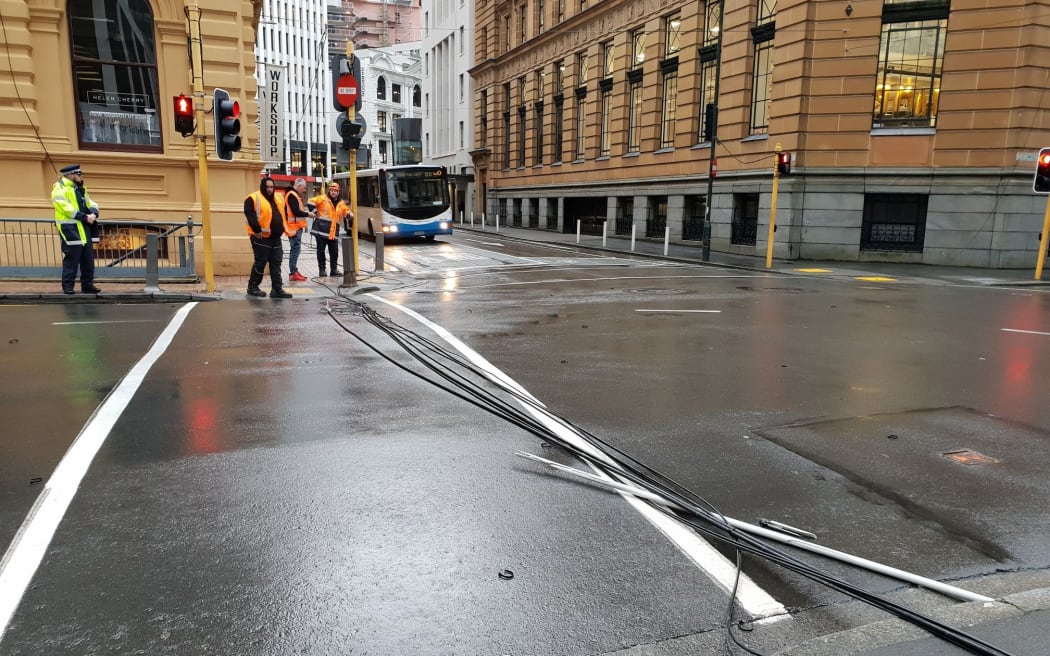 Power lines on the ground at the corner of Hunter Street and Customhouse Quay in central Wellington.