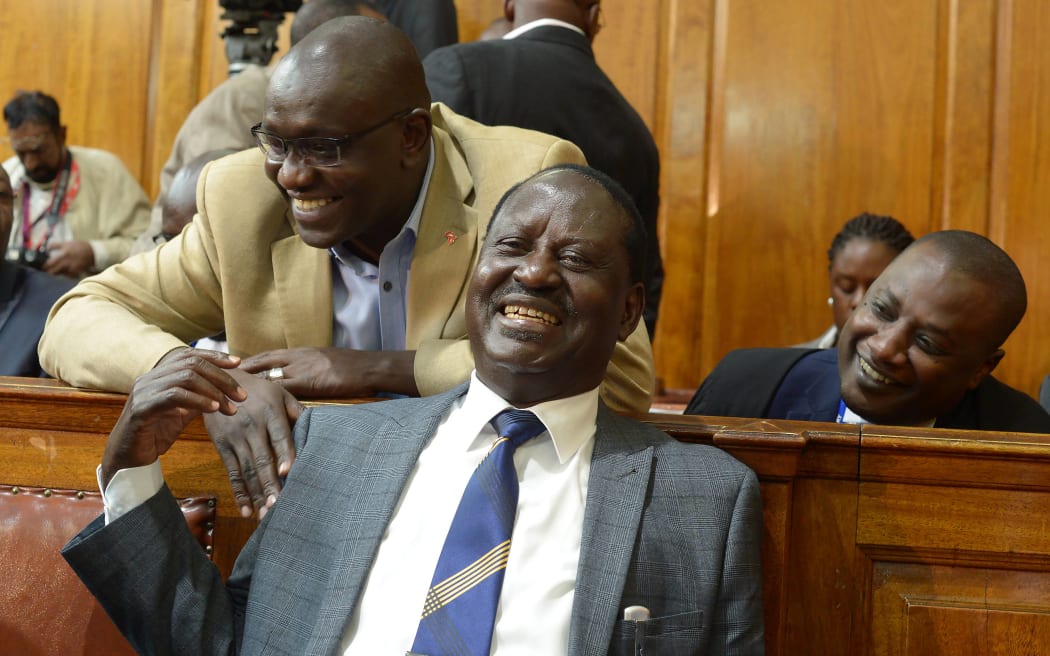 Kenya's Opposition presidential candidate Raila Odinga (centre) reacts to the ruling at the Supreme Court.