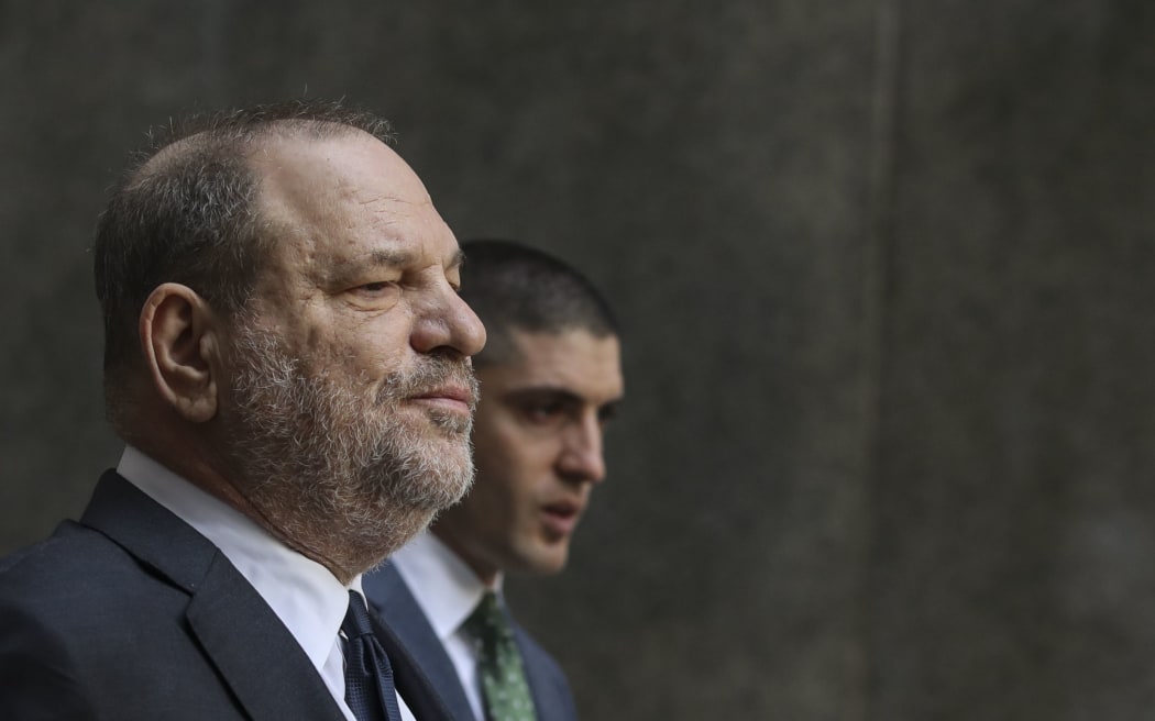 Harvey Weinstein leaves the hearing at New York Criminal Court 20 December, where a judge dismissed his bid to have two charges dropped.