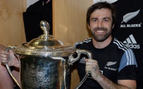 The All Blacks Conrad Smith in the dressing room with Bledisloe Cup.