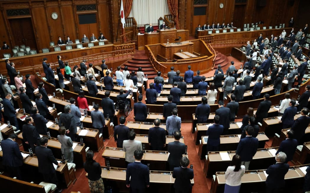 A plenary session of the Upper House passes and goes into force a bill to revised criminal law to review sex offense regulations with a majority vote at the Diet building in Tokyo on June 16, 2023. Ken Saito, Japanese Minister of Justice, bows just after the bill became law.( The Yomiuri Shimbun ) (Photo by Masanori Genko / Yomiuri / The Yomiuri Shimbun via AFP)