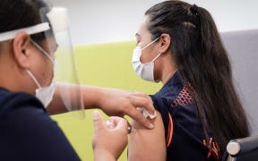 Auckland Jet Park Hotel quarantine facility worker Lorna Masoe receiving the Covid-19 vaccine on 20 February 2021.