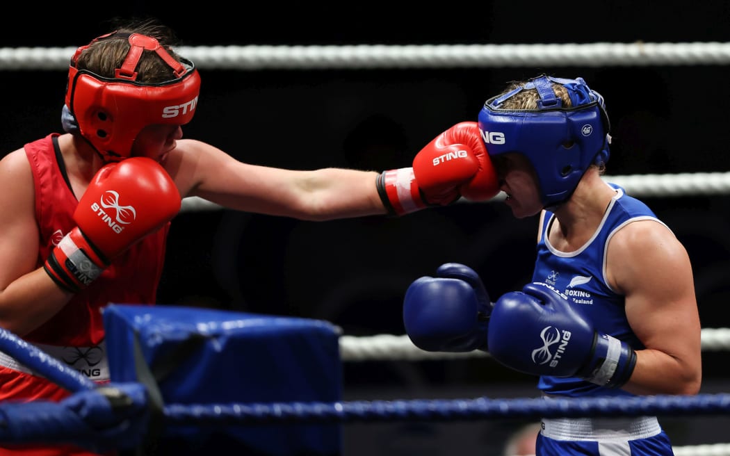 Lightweight Baylee Macdonald connects with Troy Garton (Blue) 2021 National Amateur Boxing Championships.