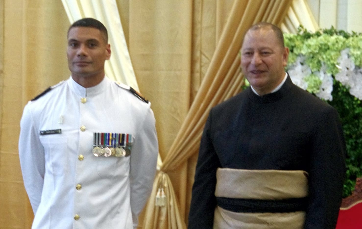 Warrant Officer Seaman Combat Specialist Mark Latu with King Tupou VI during the Tongan ruler’s recent 60th birthday celebrations.