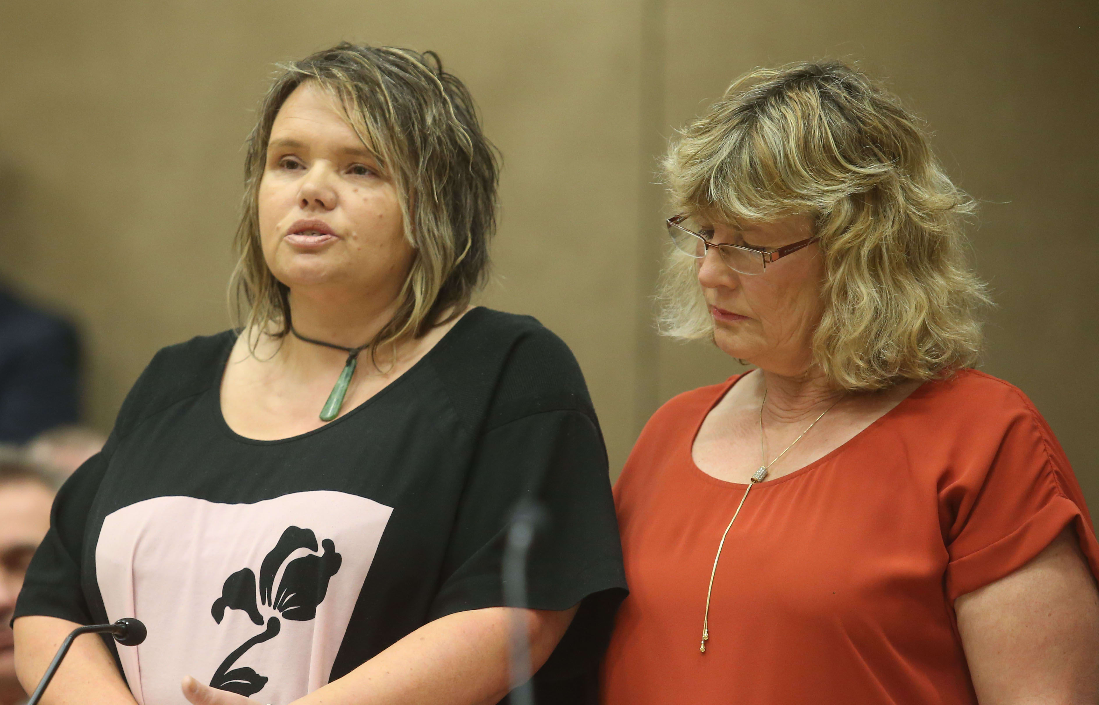 Kim Adams, left, reads her victim impact statement supported by Alison Kermode who also gave a statement.