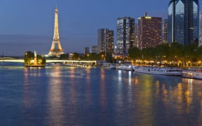 The Seine, Eiffel Tower and Quai de Grenelle, in Paris.