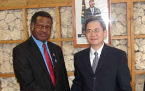 China's Vice Foreign Minister Zheng Zeguang with Ham Lini