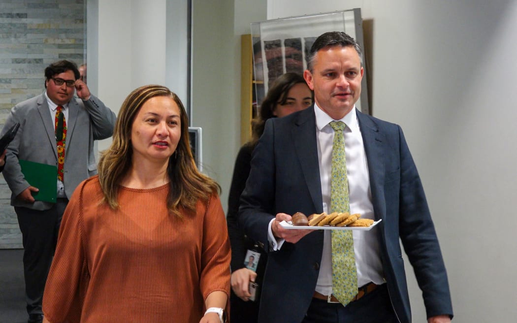 Green Party co-leaders Marama Davidson and James Shaw carrying a plate of biscuits after their talks with the Labour Party leadership at Parliament on 28 October, 2020.