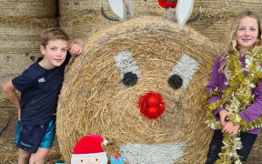 Ryan and Charleigh with their decorated hay bail.