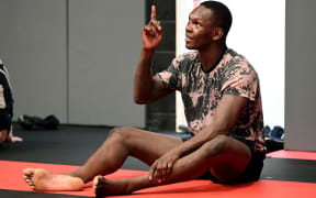 Israel Adesanya takes a break from training at City Kickboxing.