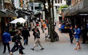 AUCKLAND,NZ - OCT 13 2015:Traffic on Vulcan Lane in Auckland downtown, New Zealand .It's a popular cobblestone plaza off Queen St home to fashionable restaurants, cafes, pubs and stores.