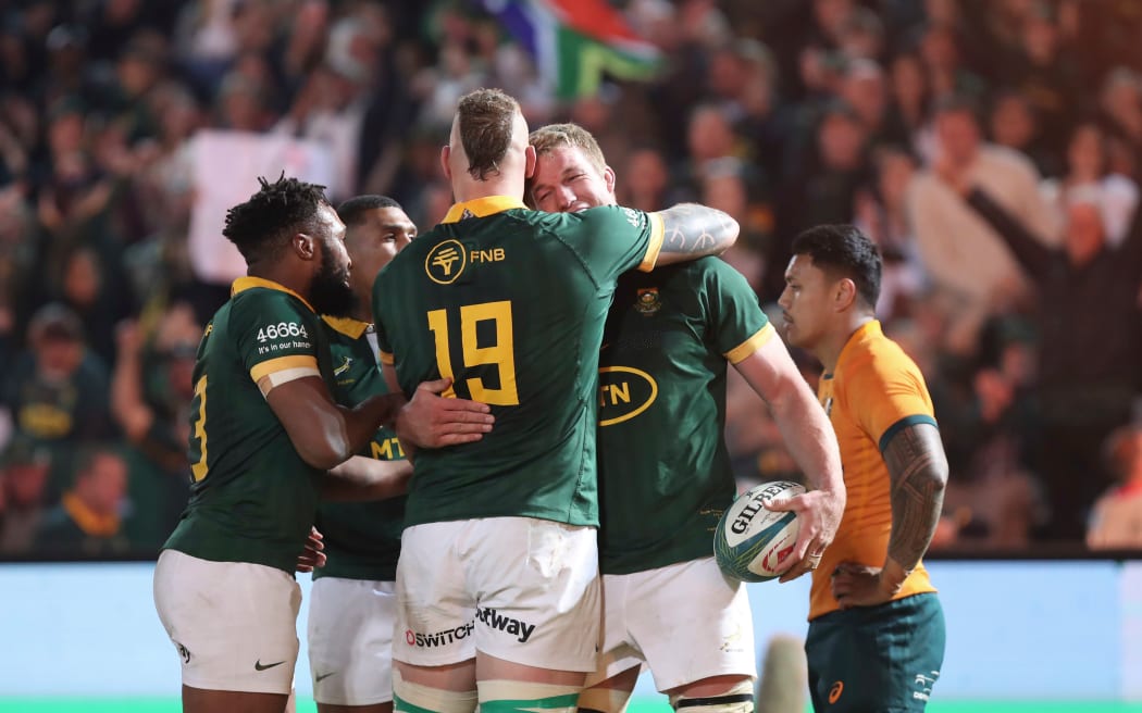 Springoks celebrate Pieter Steph du Toit's try against Australia.