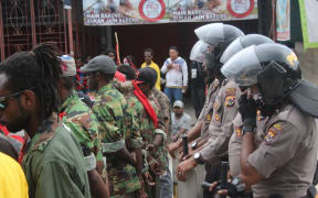 West Papuan demonstrators tightly monitored by Indonesian police.