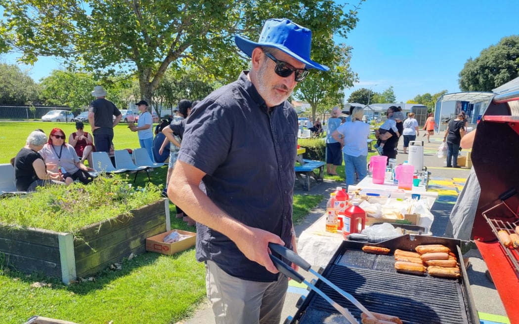 Marewa School principal Chris Meynell cooks a BBQ for the school community.