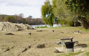 The banks of the Wairoa River, which runs through the town, remain covered in nearly a metre of silt three months after the cyclone.