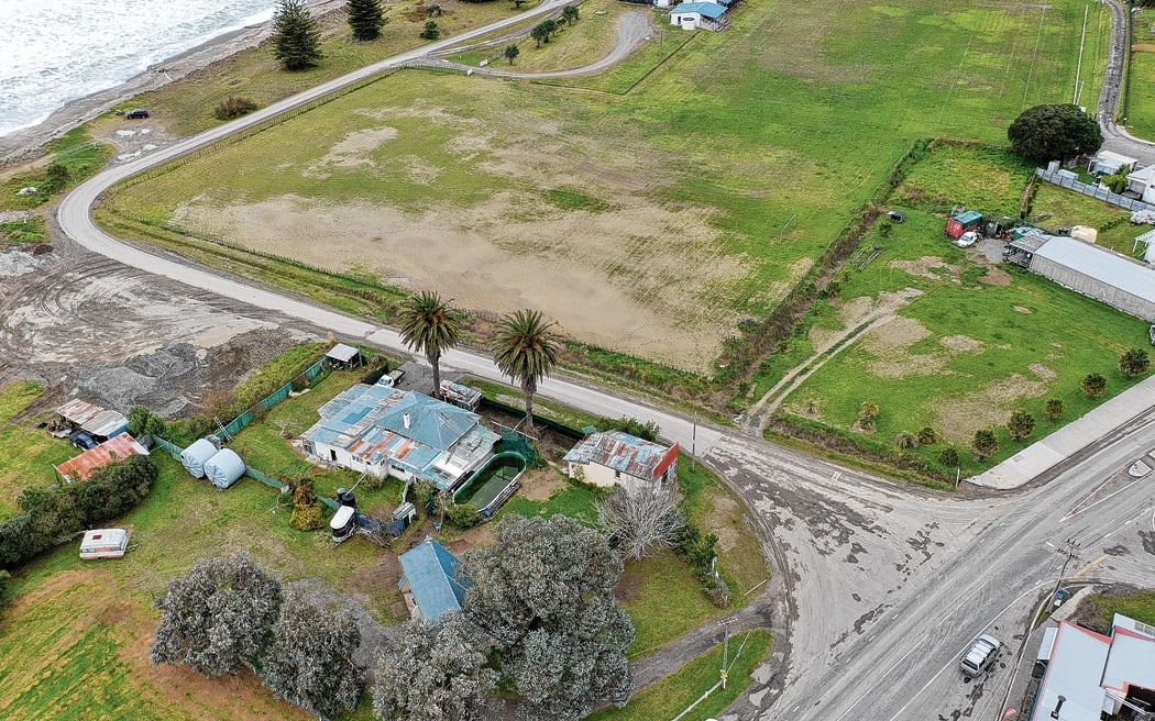 Sections of land in Tokomaru Bay, including the pictured house with pool and a patch adjacent to the large field across the road, are held under perpetual lease.