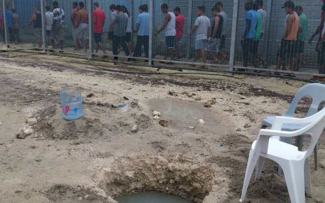 Manus Island refugees and one of their wells.