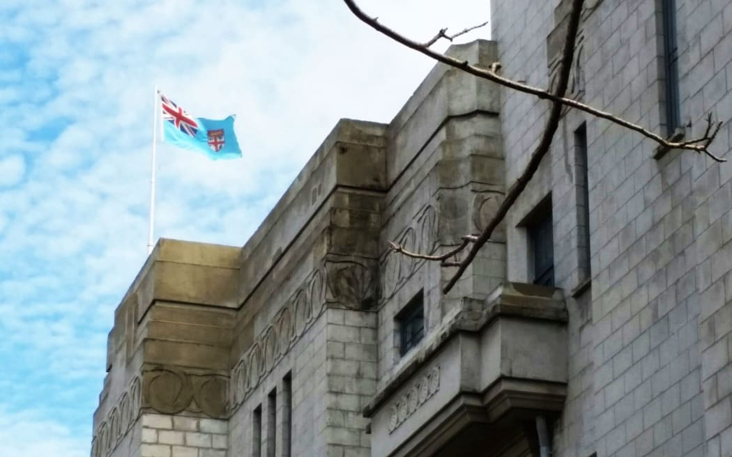 Fiji flag flies on the rooftop of parliament
