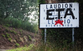 September 6, 2010 graffiti in favour of Basque armed group ETA covers a sign welcoming visitors to the Northern Spanish Basque village of Llodio. 
ETA announced it was fully disbanding in a letter on May 2, 2018.