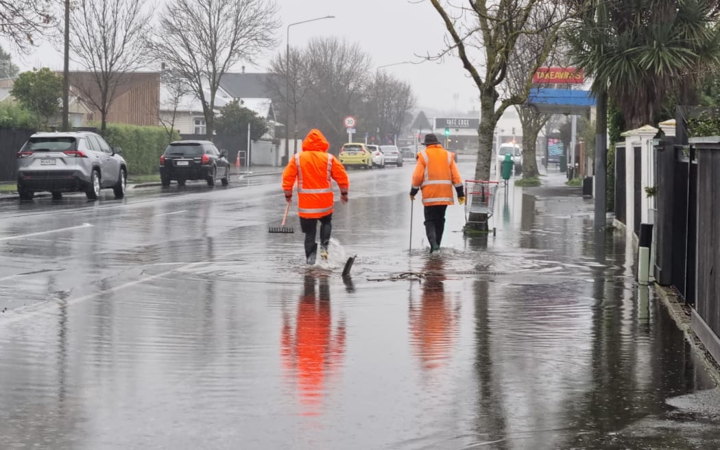 Council contractors clean stormwater drains in Edgeware, Christchurch, July 26, 2022.