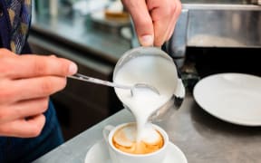 Barista preparing a cappuccino