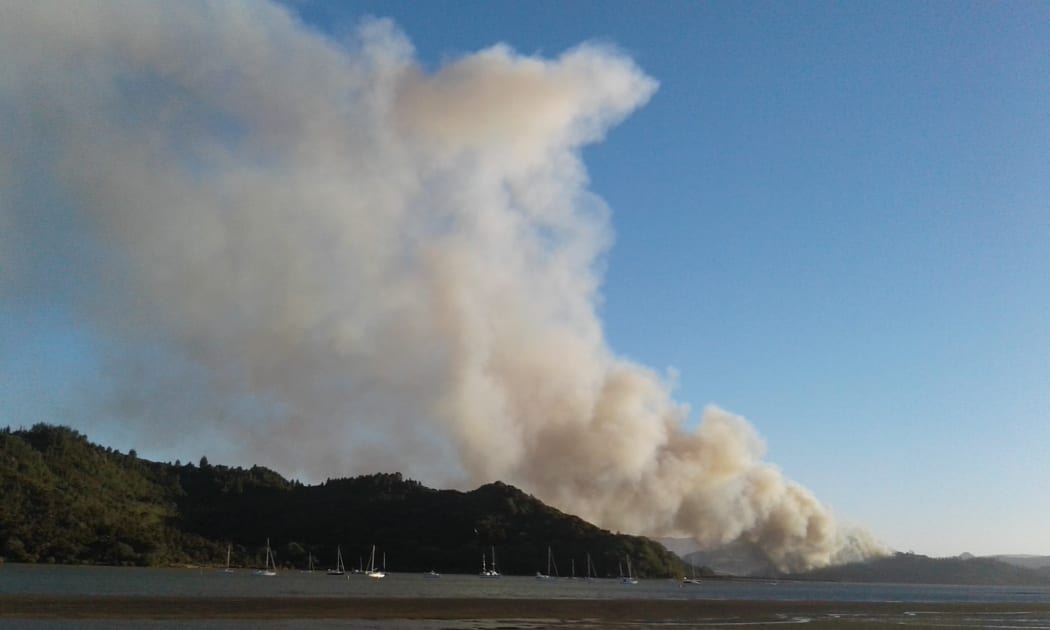 A photo taken about 7.50pm shows a fire burning near the town of Whitianga.