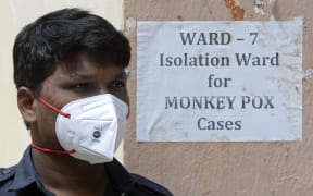 A security guard stands at the entrance of an isolation ward for monkeypox patients at a government hospital in Hyderabad on July 25.
